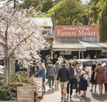 Matakana Village Farmers’ Market with visitors shopping local produce